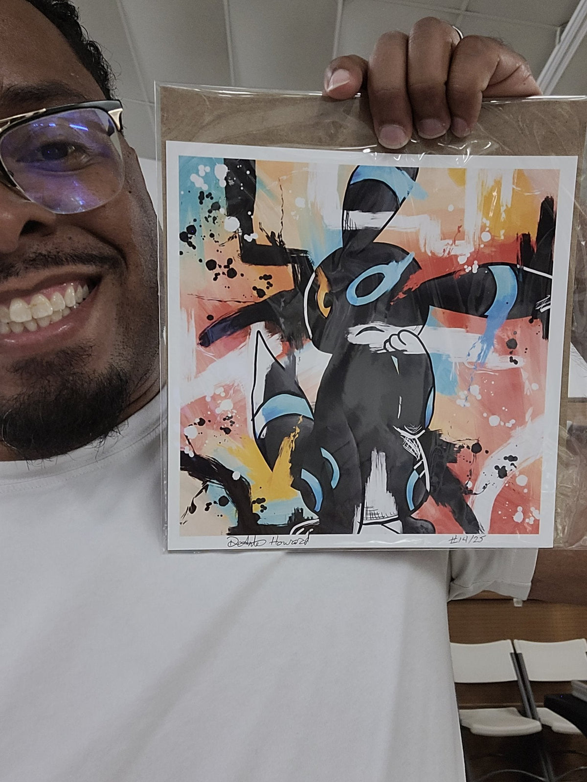 Deante Howard holding the Umbreon 8x8 art print
