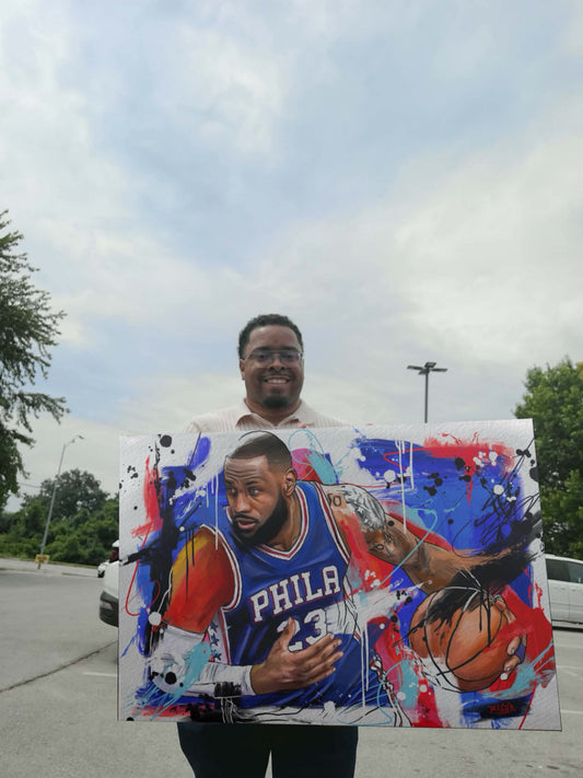 Deante Howard holding the LeBron original painting
