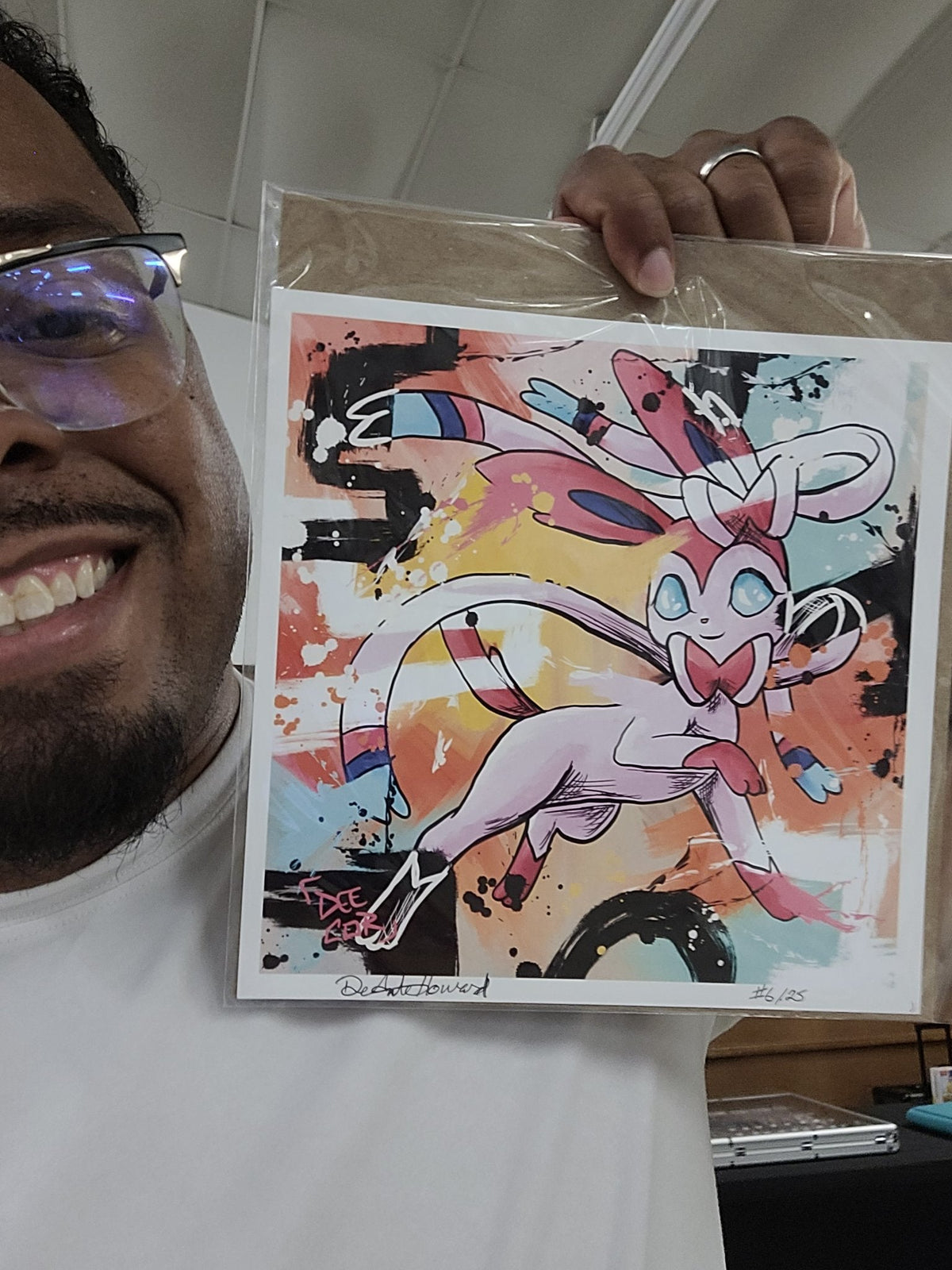 Deante Howard holding the Sylveon 8x8 art print